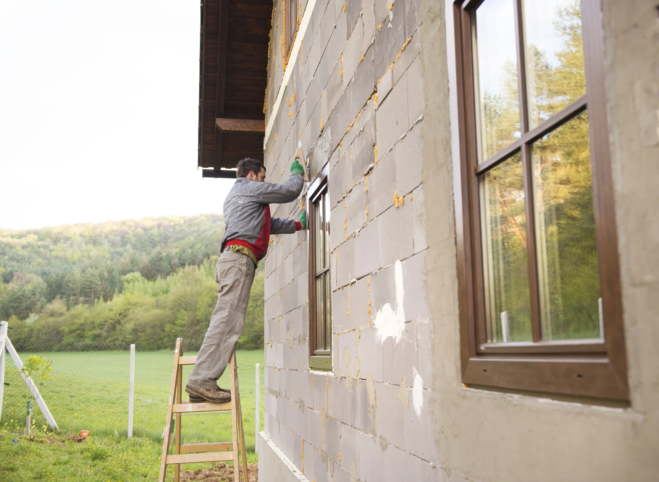 KB Better Construction crew boarding up windows